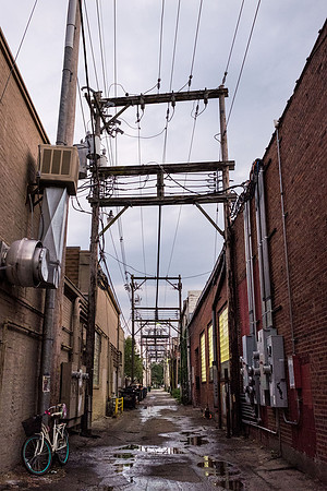 Downtown Lawrence Alley With Blue Wheeled Bike